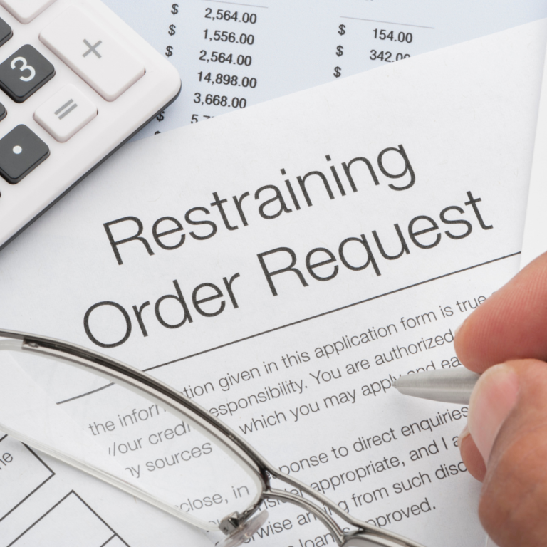 Woman filling out restraining order request in Massachusetts.
