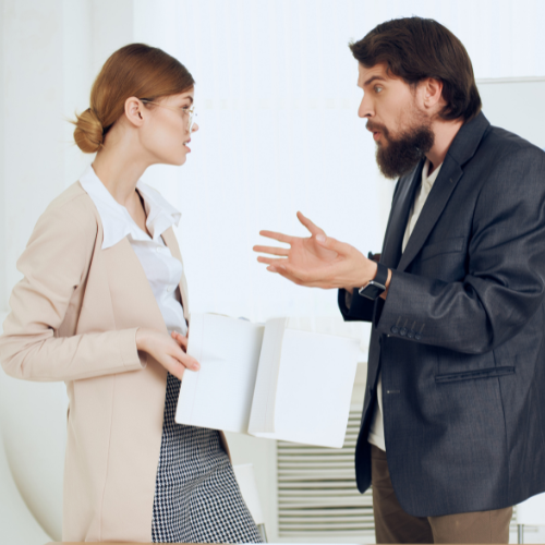 Man and woman arguing at work, but it's not harassment according to Massachusetts law.